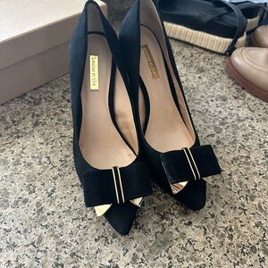 Louise et Cie Black Suede Pointed Toe Pumps with Bow and Gold Accents
